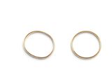 a pair of gold rings on a white background