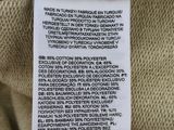 a close up of a label on the back of a sweater