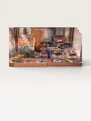 a picture of a display case with toy cars on it