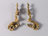 pair of antique brass candlesticks on a white background