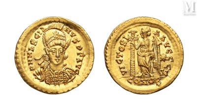 a gold coin with an image of a man on it
