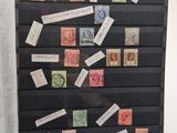 a picture of a refrigerator covered with stamps and stickers