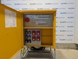 a yellow box that has a bunch of electrical equipment inside of it