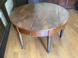 a wooden table with a wooden top on a hard wood floor