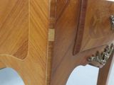a wooden table with a drawer on top of it