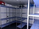 a small room with a lot of shelvings in it