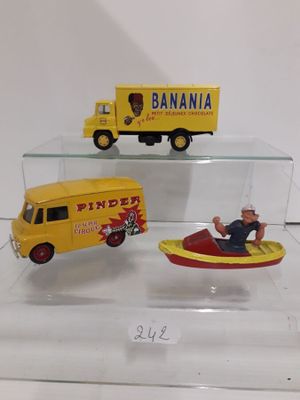 three toy vehicles that are on display in a glass case