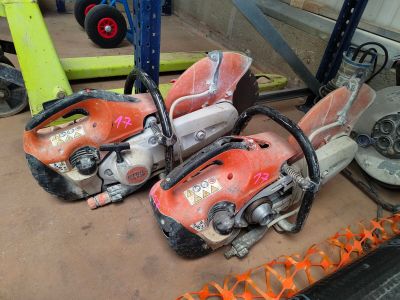 two chainsaws that are sitting on top of a table
