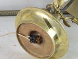 a clock that is sitting on a table next to a wall