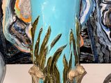 two vases that are sitting on a table