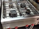 a metal stove with a burner on it in a kitchen