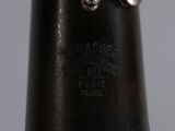 a close up of a black vase with a silver ring on it