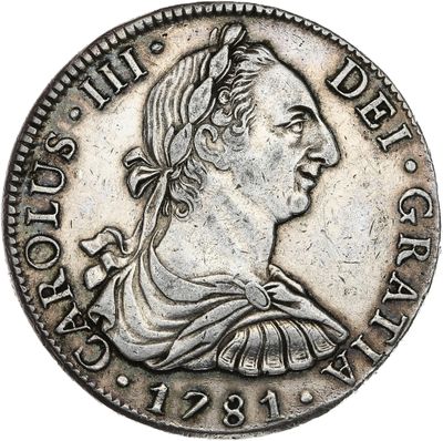 a silver coin with an image of a woman in profile