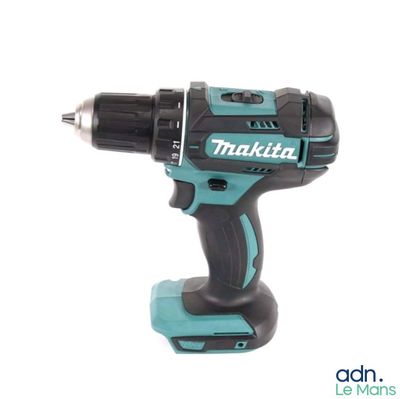 a close up of a cordless drill on a white background