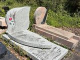 many graves in a cemetery with a flower on it