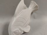 pair of white ceramic fish figurines on a white background