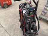 a fire extinguisor sitting on a cart in a garage