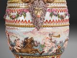 a vase with a painting of a man on a horse