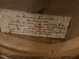 a piece of paper on the bottom of a vase