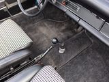 dashboard of a car with a checkered seat belt and steering wheel