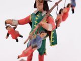 a figurine of a man with a sword and other figures