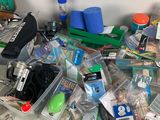 a pile of items on the floor next to a wall