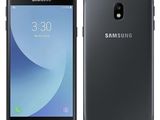 un smartphone Samsung Galaxy J2 noir posé sur un fond blanc