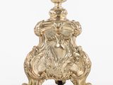 an antique silver plated table lamp with a lion head on the base