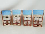 three shot glasses with a picture of a man and a woman on a swing