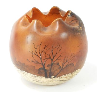 a brown vase with a picture of a tree on it
