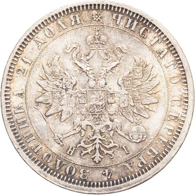 a close up of a silver coin with a crown on it