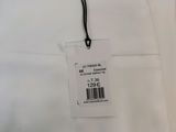 a close up of a white shirt with a tag on it