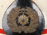 a close up of a helmet with a badge on it