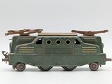 a green toy train on a white surface