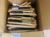 a lot of brushes in a box with a price tag
