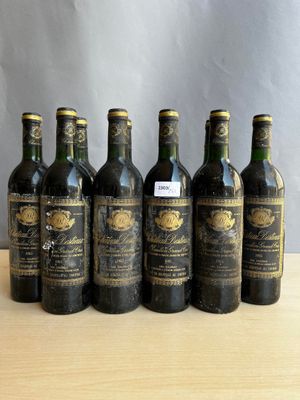 six bottles of wine are lined up in a row on a table