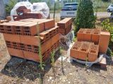 many bricks stacked on top of each other in the yard
