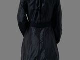 a mannequin wearing a black coat and white tights