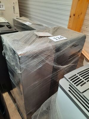 a stack of boxes sitting on top of a pallet in a warehouse