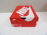 red box with white nike logo on it sitting on a white surface