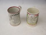 two coffee mugs sitting next to each other on a table