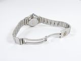 an image of a watch on a bracelet on a white surface