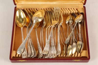 silverware in a red box with gold handles and spoons in it