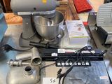 a picture of a kitchen counter with a mixer and a laptop