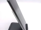a close up of a cell phone on a stand