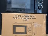 a box with a microwave on top of it on a table