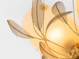a chandelier that has a bunch of golden ornaments on it