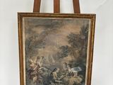 un vieux tableau posé sur un chevalet, représentant un homme et une femme