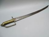 a close up of a knife on a table with a handle
