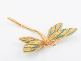 an image of a gold dragonfly brooch with turquoise and pink stones